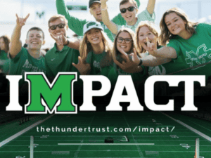Group of IMPACT Students cheering on the Marshall Football Team